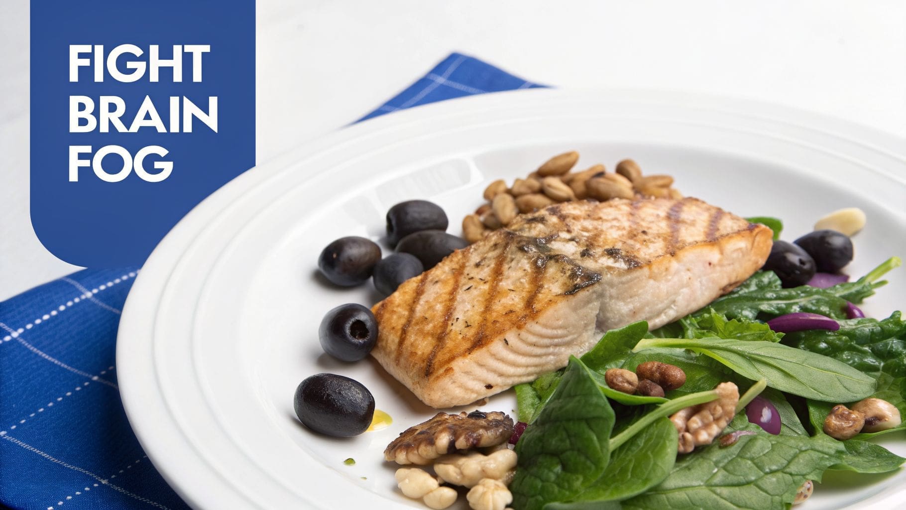 A healthy plate with grilled salmon, spinach salad, mixed nuts, and black olives.