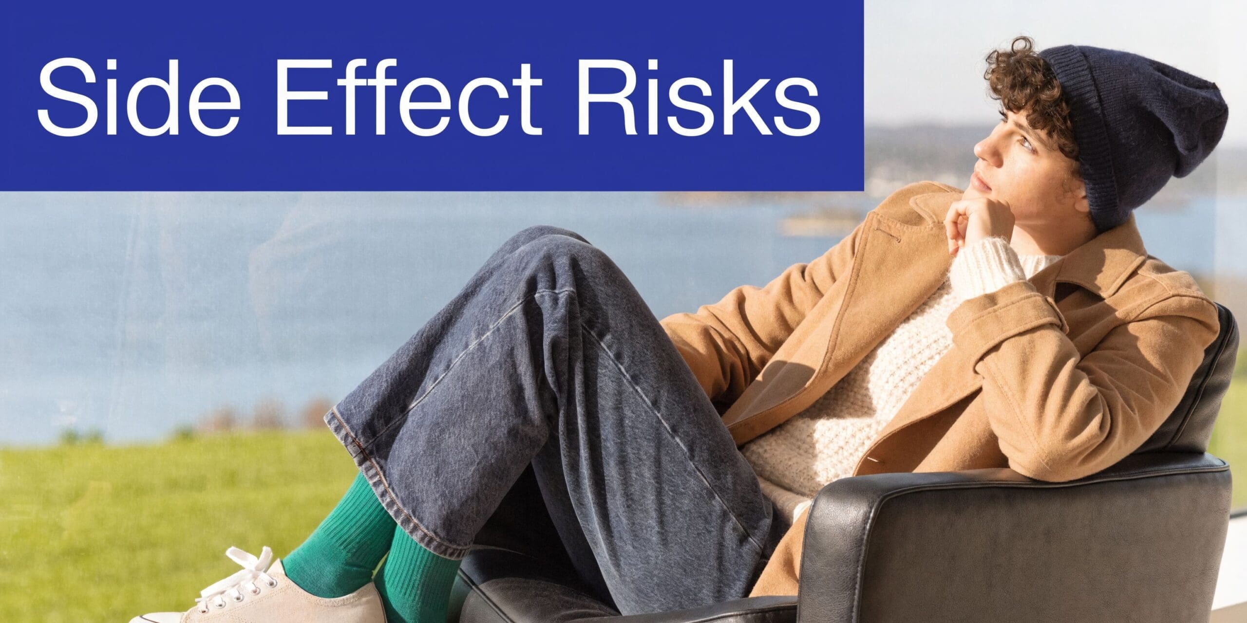 A contemplative young man sitting in a leather chair near a window thinking about medical side effects.