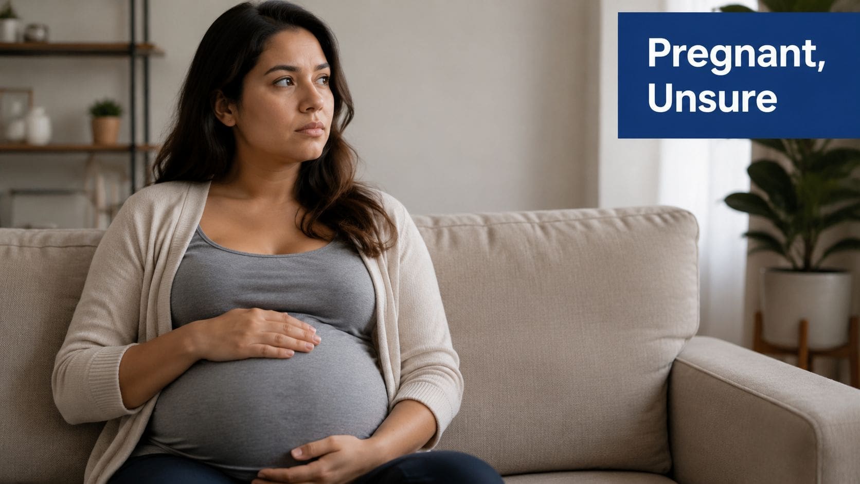 A pregnant woman sitting on a couch feeling concerned while considering ADHD medication during her pregnancy.